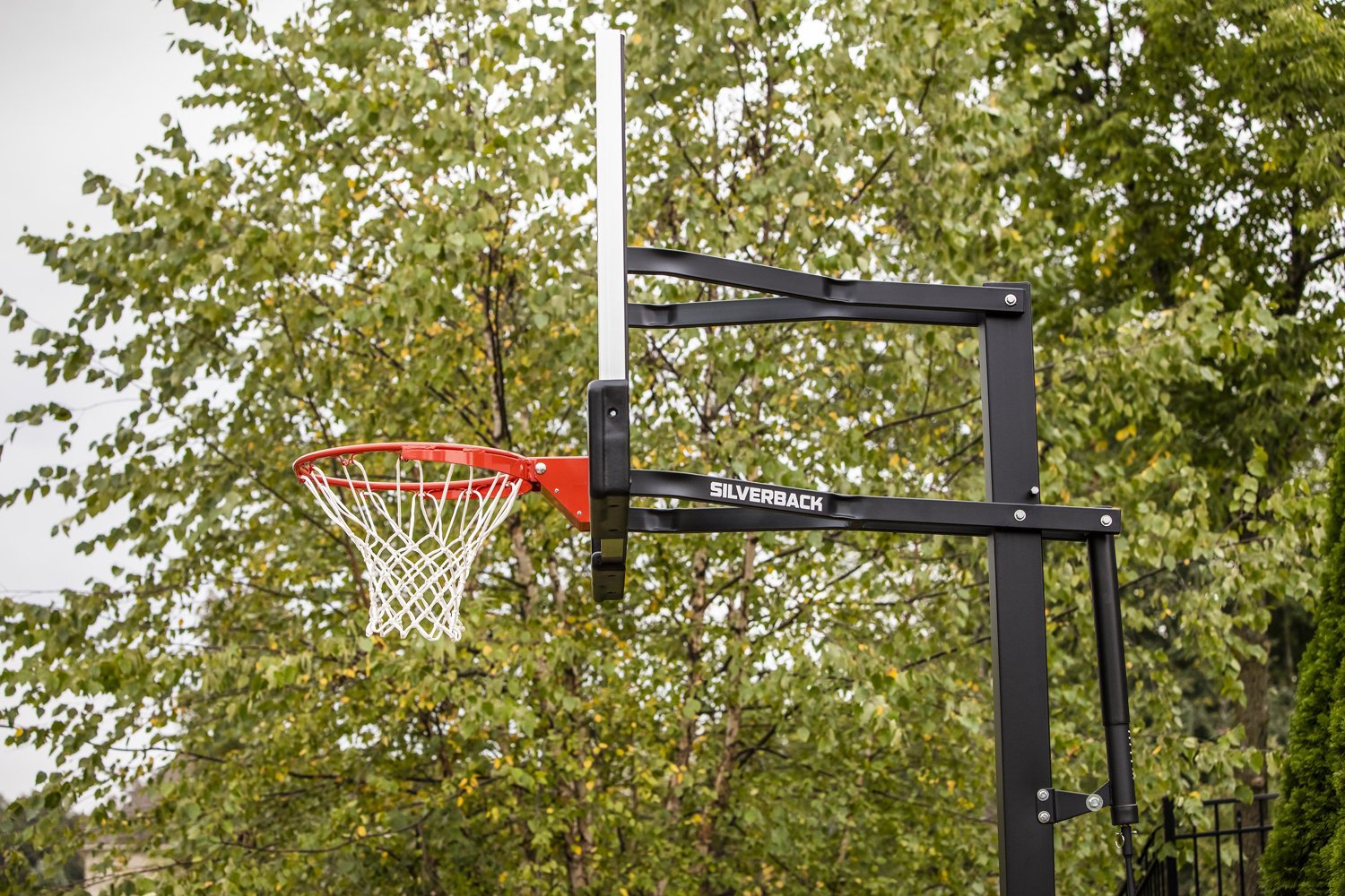 Silverback 54 in Inground TemperedGlass Outdoor Basketball Hoop Academy