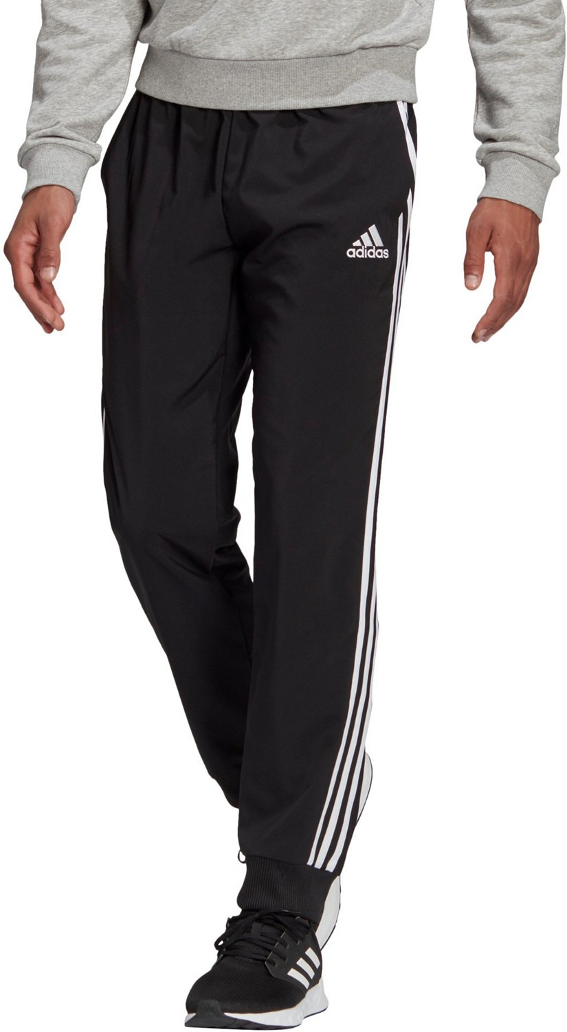 essentials fleece tapered cuff logo pants