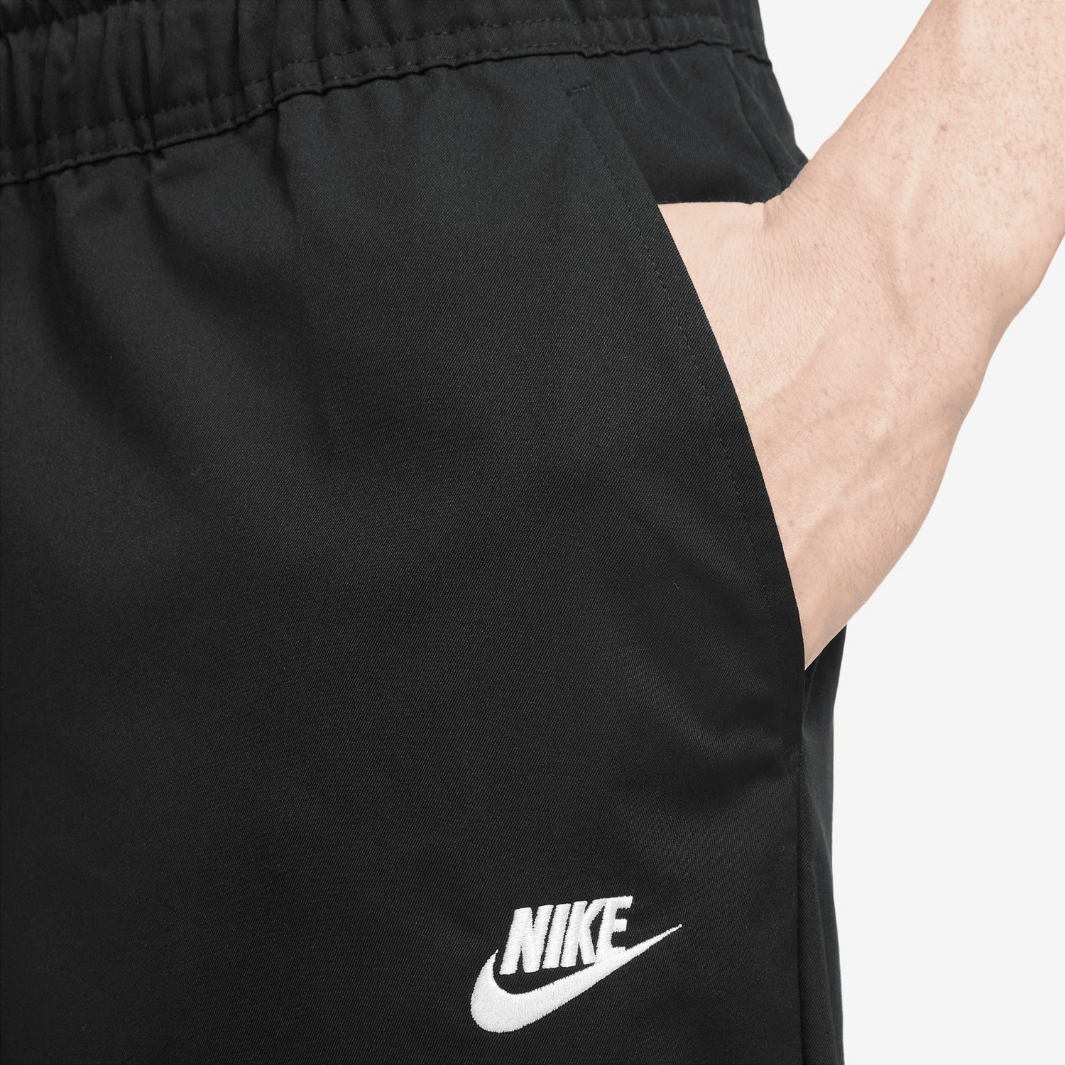 Nike Club Men's Woven Tapered Leg Pants.