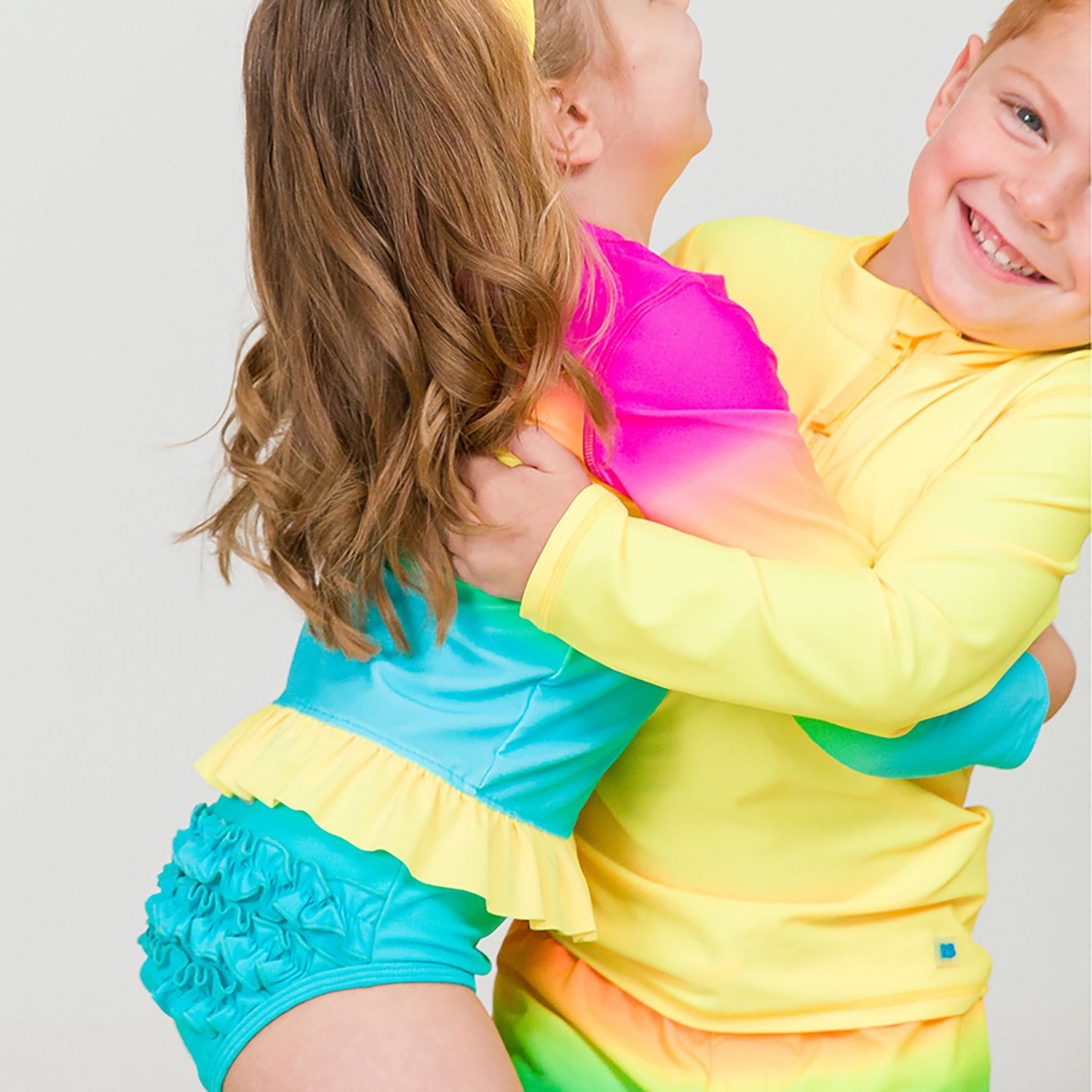 RuffleButts Girls' 4-7 Neon Sunset Long Sleeve Bikini Rash Guard