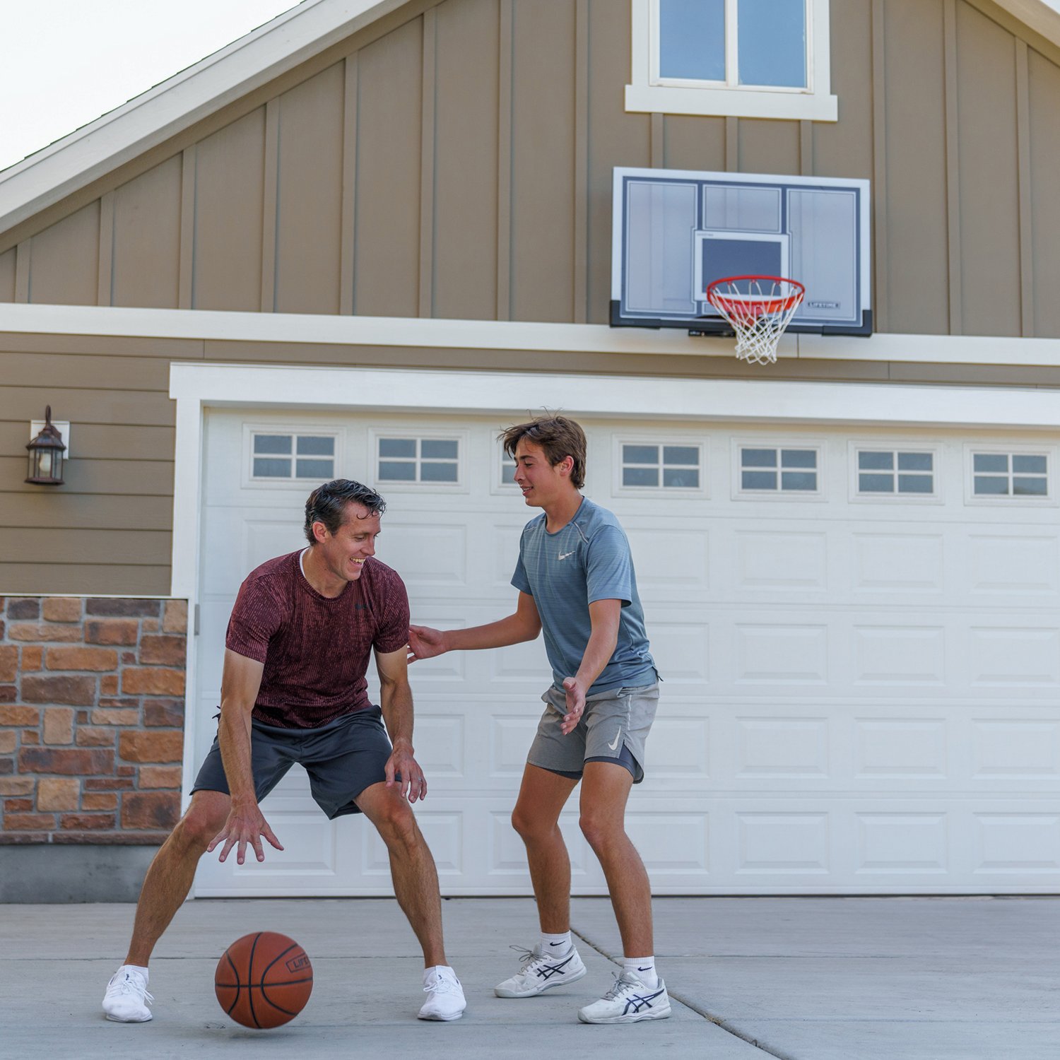Lifetime 44 in Shatterproof Portable Basketball Hoop with Action Grip Adjustment & Slam-It Rim - view number 7